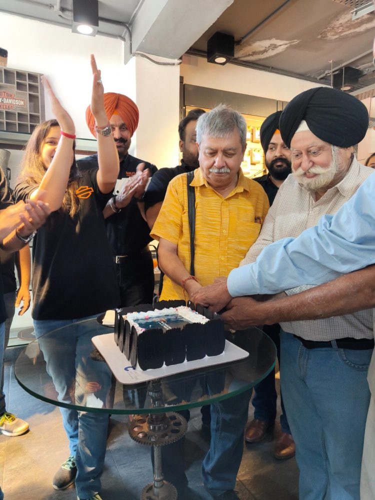 Cake Cutting ceremony by Senior Journalist at Harley Davidson Showroom